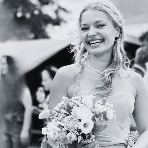 happy-female-winner-of-the-wedding-bouquet