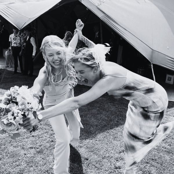 Two-female-guests-catching-the-wedding-bouquet