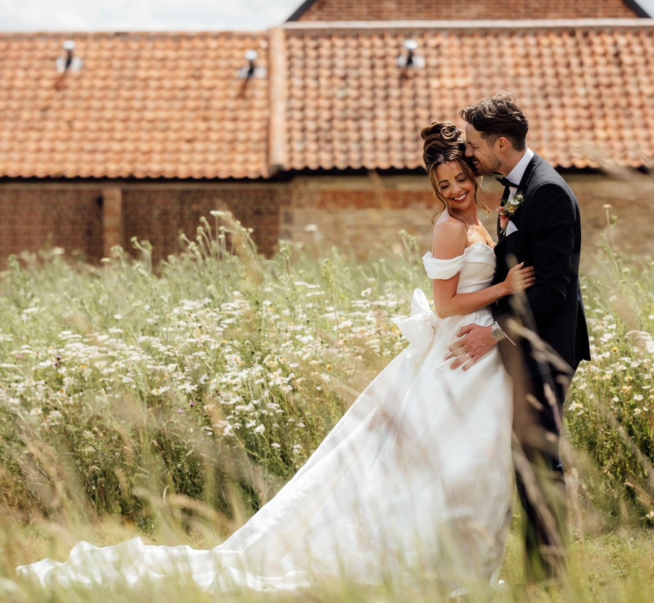 Couple in wildflower meadow Couple in Wildflower Meadow