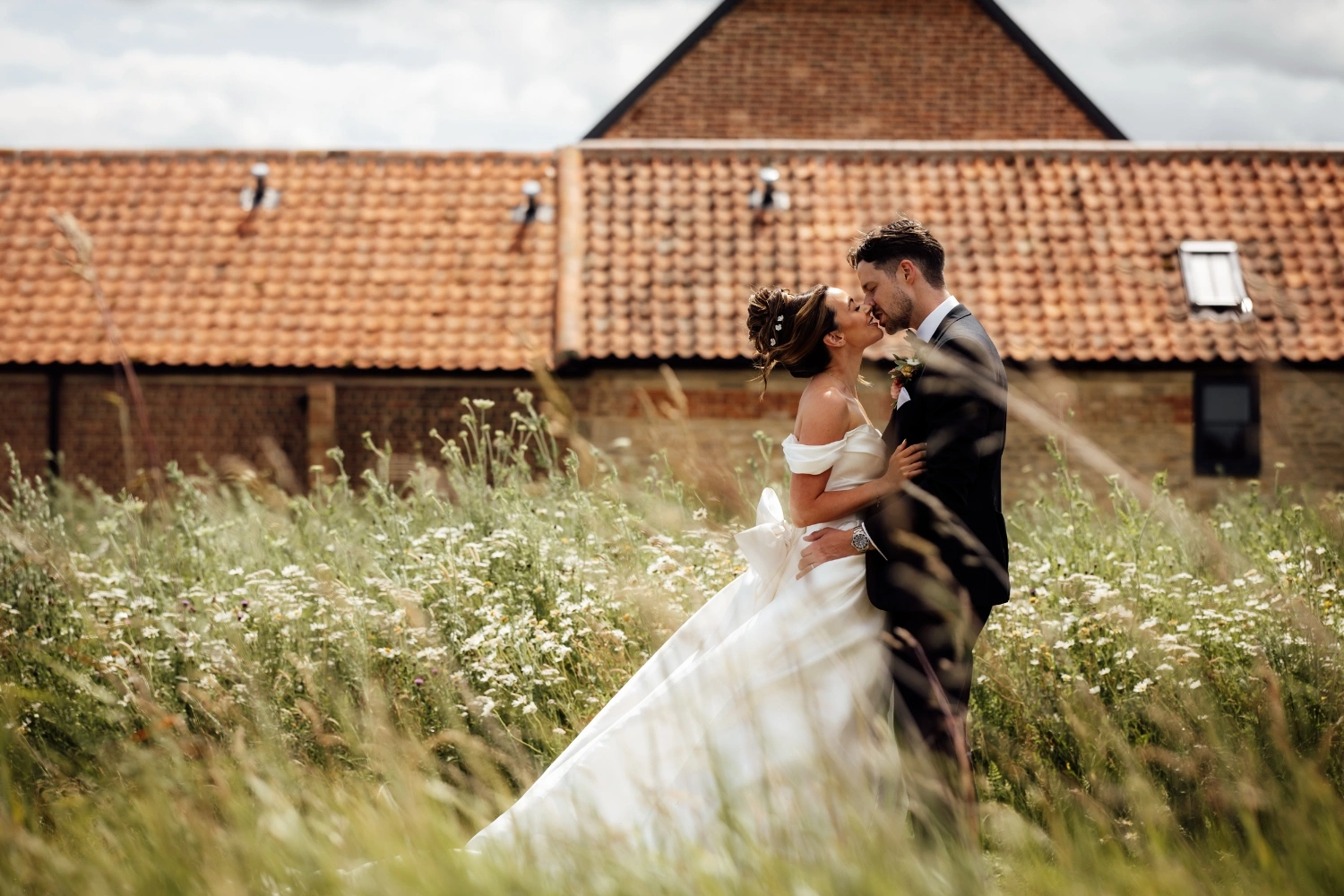 Couple in wildflower meadow Wedding Couple in meadow