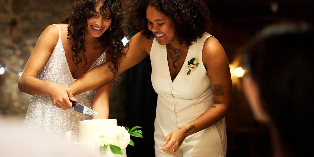 cutting the cake Two brides cutting the cake