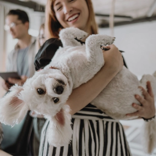 A lady holding her dog