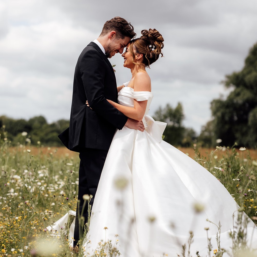 Wedding couple in wildflower meadow